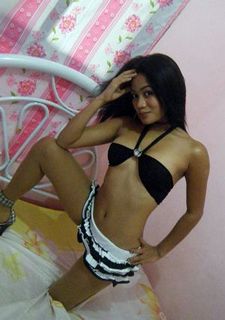 Hot Filipina in her bedroom posing in front of webcam.